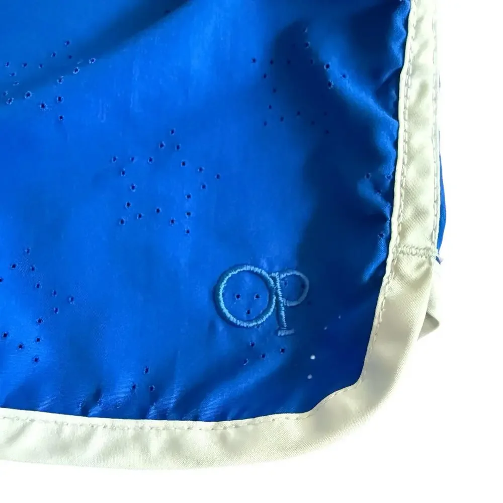 OP Girl’s cobalt blue athletic shorts, star die-cut pattern and white trim, M